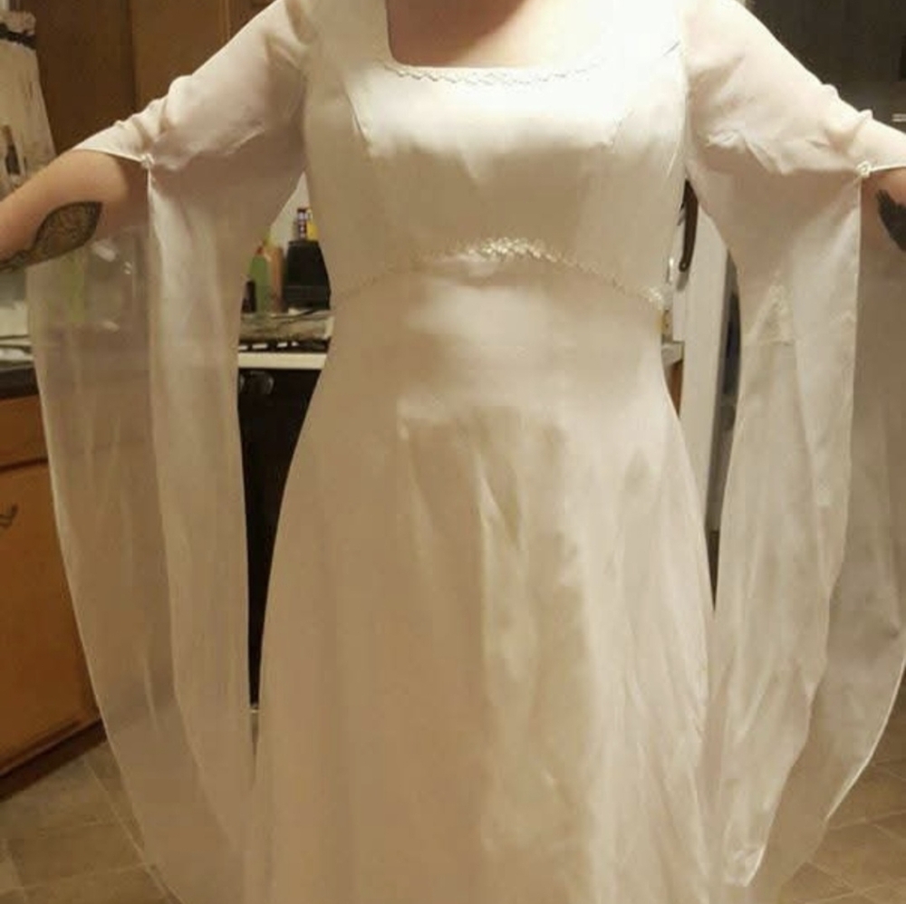 Elegant White Gown with Sheer Sleeves